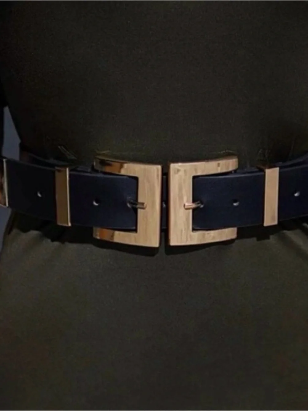 Dramatic black vegan leather belt with double bright gold buckles.